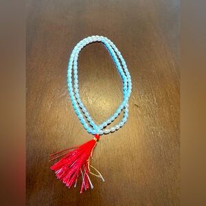Beaded Necklace with Red Tassel